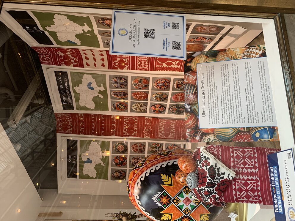 a display of a store window with a sign and eggs