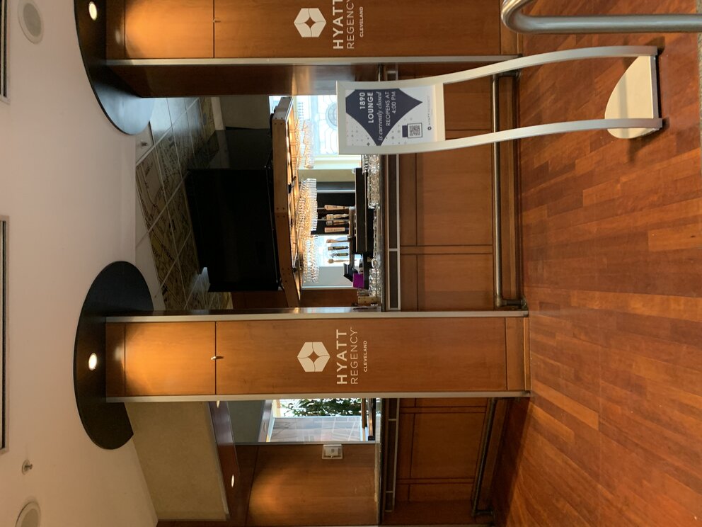 a restaurant with a bar and a sign