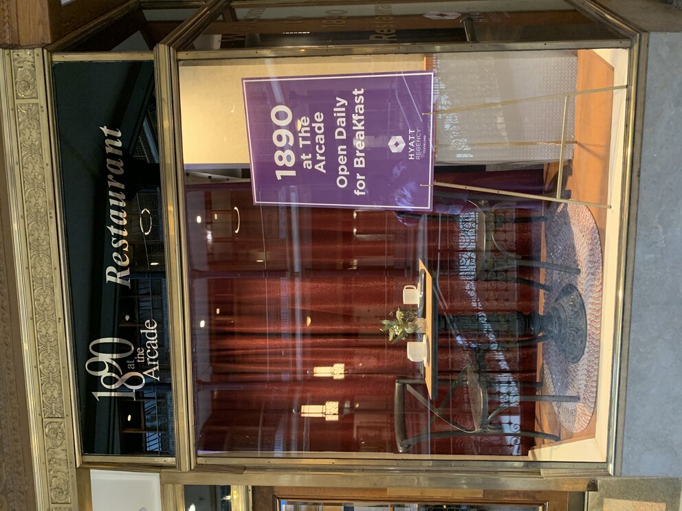 a restaurant with a table and chairs