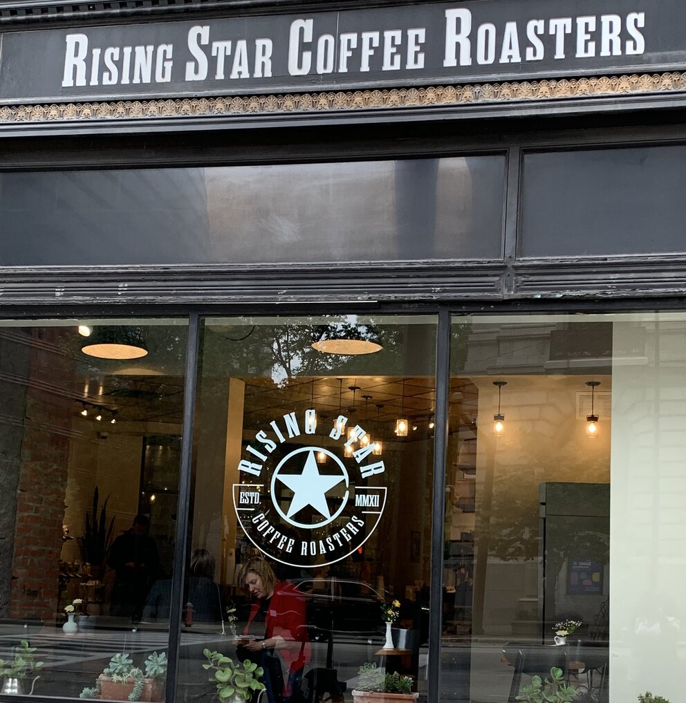 a store front with a sign on the window