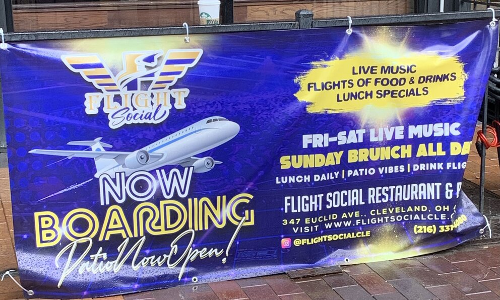 a sign on the sidewalk